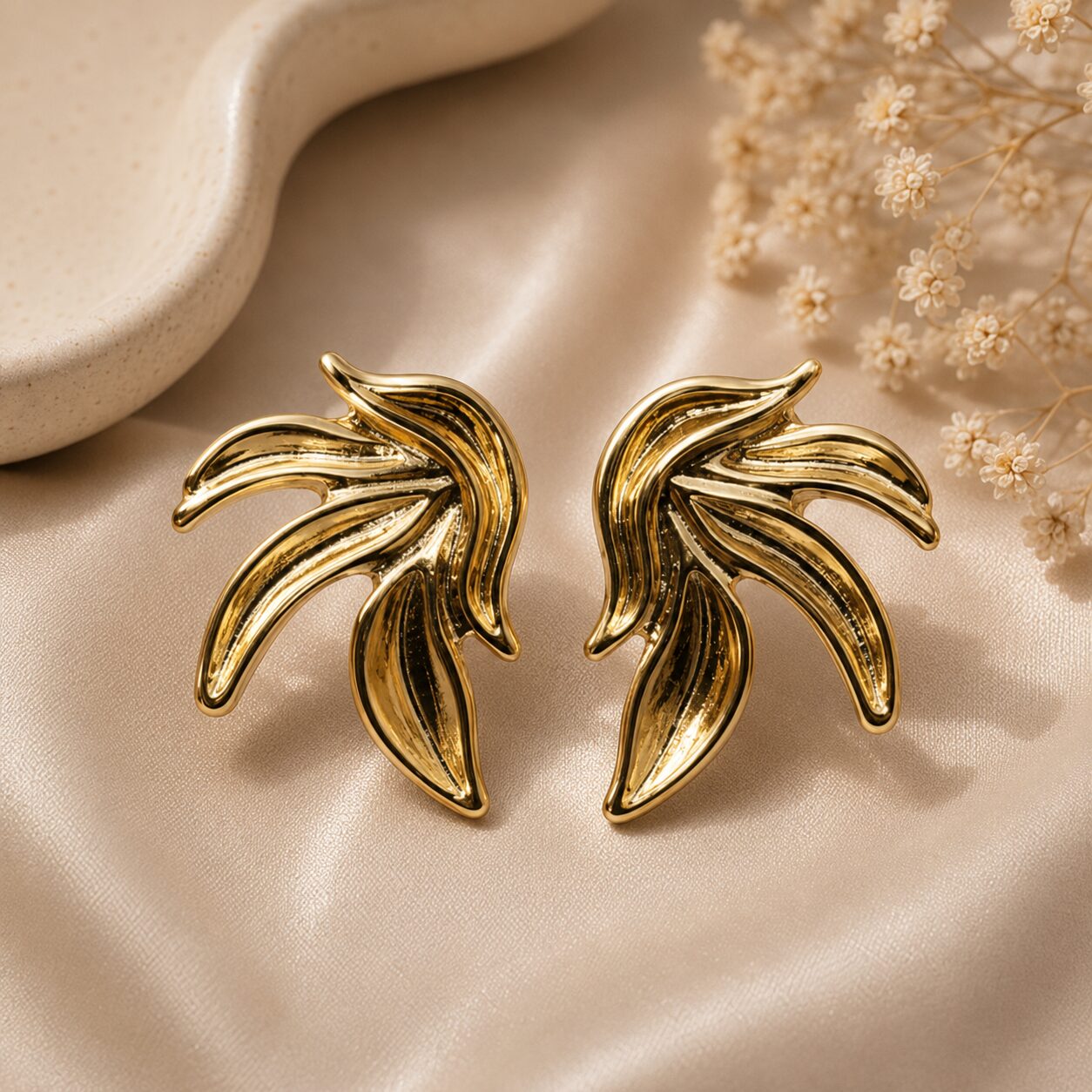 2026/07/17332.jpg Golden Sculpted Leaf Statement Earrings - Image 1