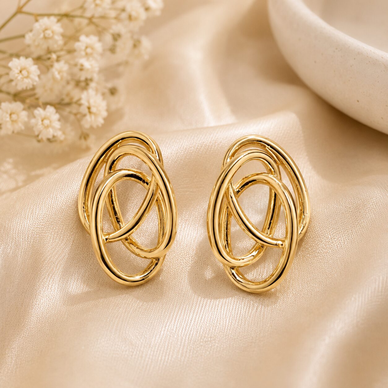 2026/07/17548.jpg Golden Intertwined Loop Statement Stud Earrings - Image 1