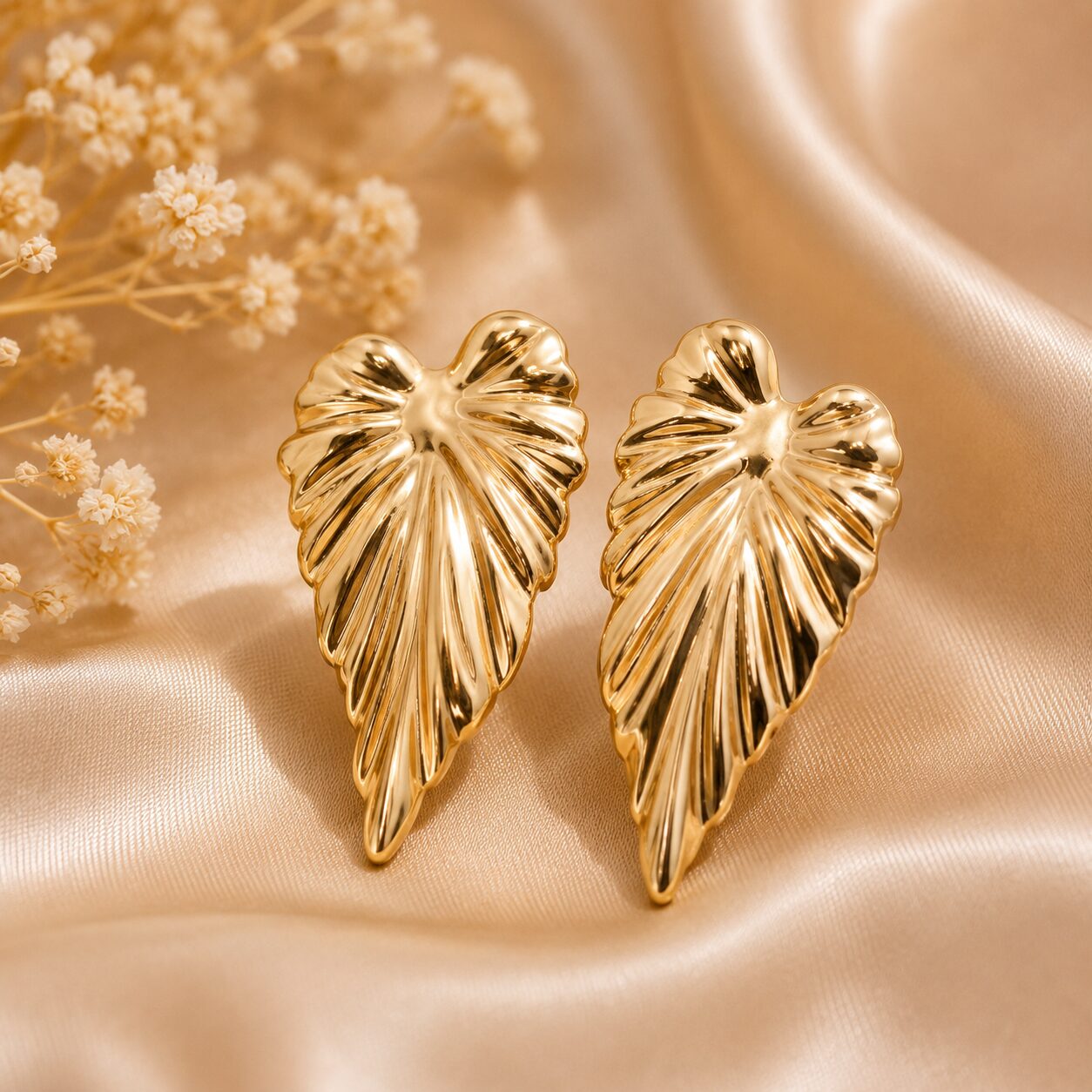 2026/07/17615.jpg Golden Tropical Leaf Statement Stud Earrings - Image 1