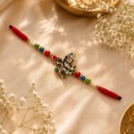 Designer Lord Krishna Rakhi with Multicolor Beads Pack of 6 (R. Rangoli-3631)