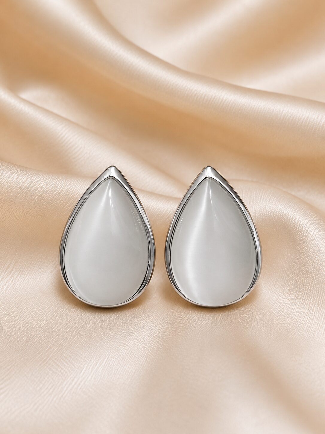 2026/08/1001771670.jpg White Teardrop Cat Eye Stud Earrings - Image 1