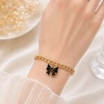 Black Bow Charm Gold Bracelet