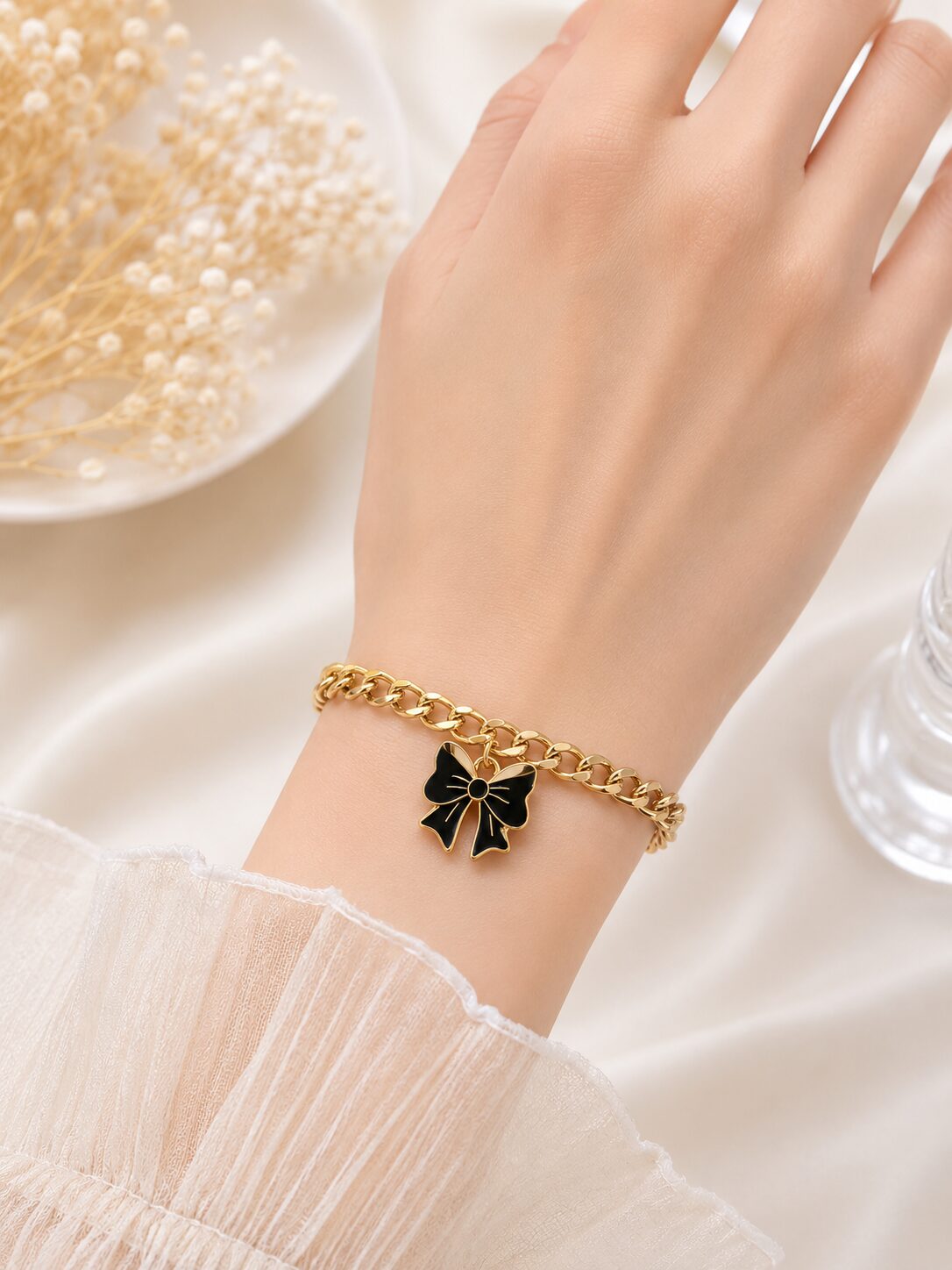 2026/08/1001771693-1.jpg Black Bow Charm Gold Bracelet - Image 1