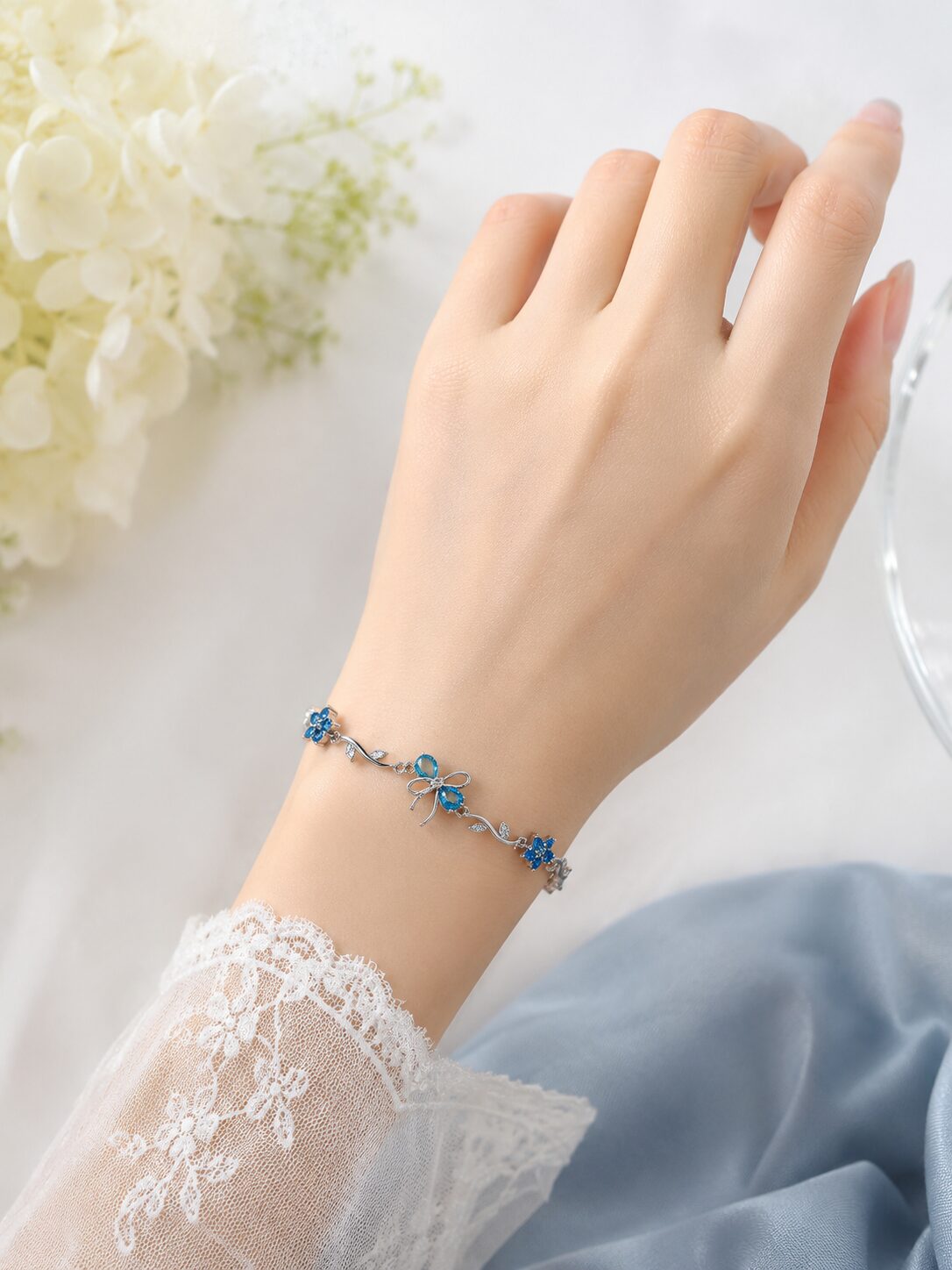 2026/08/1001772319.jpg Elegant Blue Floral Hand Bracelet - Image 1