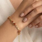 Elegant Gold & Red Floral Bow Charm Bracelet