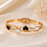 Elegant Gold Heart Charm Bangle with Black & White Stones