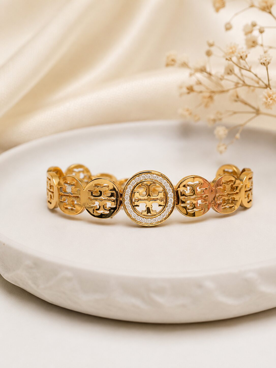 2026/08/1001772970.jpg Premium Gold-Tone Designer Link Bracelet with Crystal Center Detail - Image 1