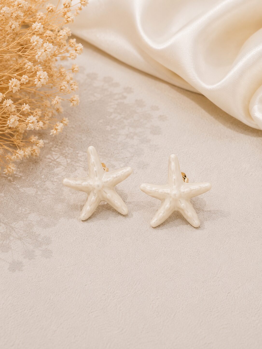 2026/08/1001777502.jpg Ivory Starfish Stainless Steel Earrings - Image 1