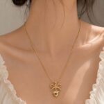 Elegant Gold Bow Heart Necklace