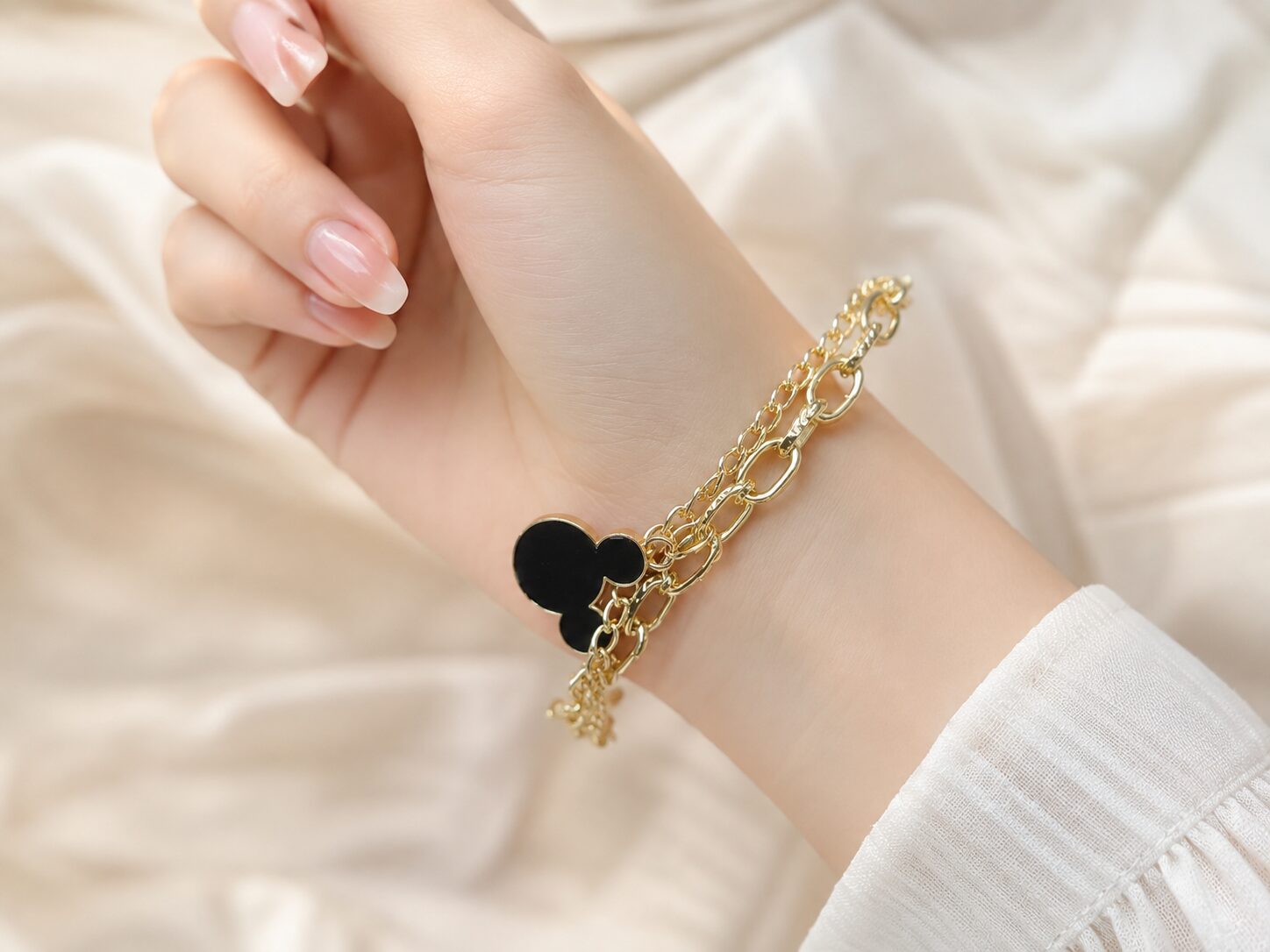 2026/08/1003577929.jpg Black Clover Charm Gold Layered Bracelet - Image 1