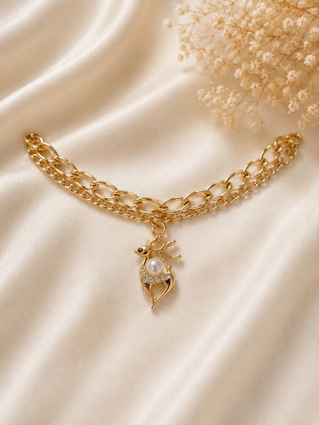 2026/08/1003579621.jpg Elegant Reindeer Pearl Charm Gold Chain - Image 1