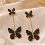 Black Butterfly Long Drop Earrings with Golden Detailing