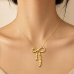 Pearl Bow Pendant Gold-Tone Stainless Steel Necklace