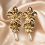 Premium layered floral pearl-drop earrings photoshoot created.