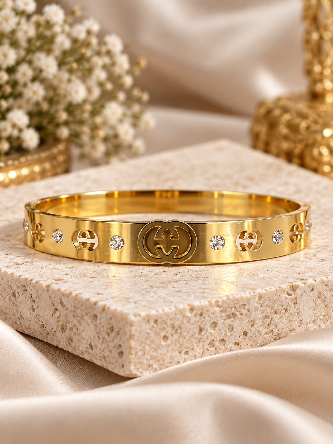 2026/09/1003580188.jpg Luxury Gold Designer Bangle with Sparkling Stone Detailing - Image 1