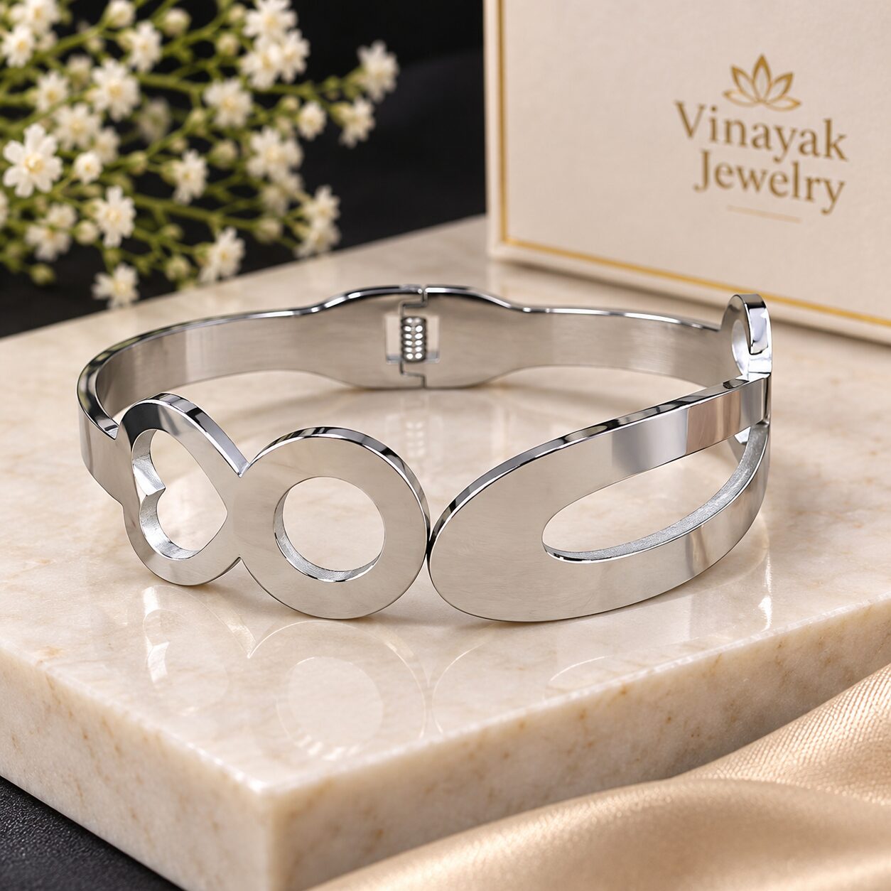2026/09/1003580198.jpg Elegant Silver Infinity Oval Bangle - Image 1