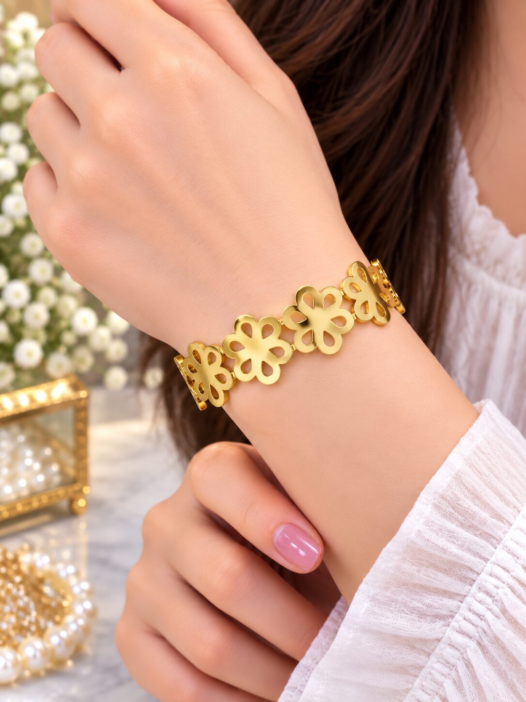 2026/09/1003580276.jpg Elegant Gold Floral Cutout Bracelet - Image 1