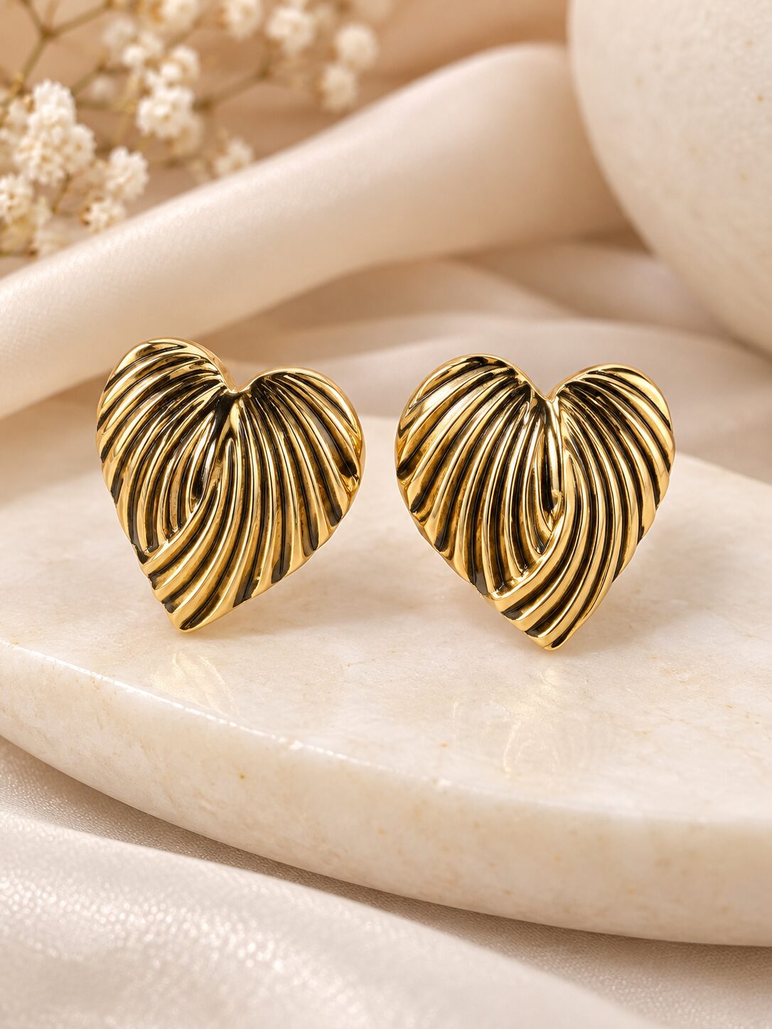 2026/09/1003581705.jpg Golden Heart-Shaped Ribbed Statement Earrings | Korean Style Jewellery - Image 1