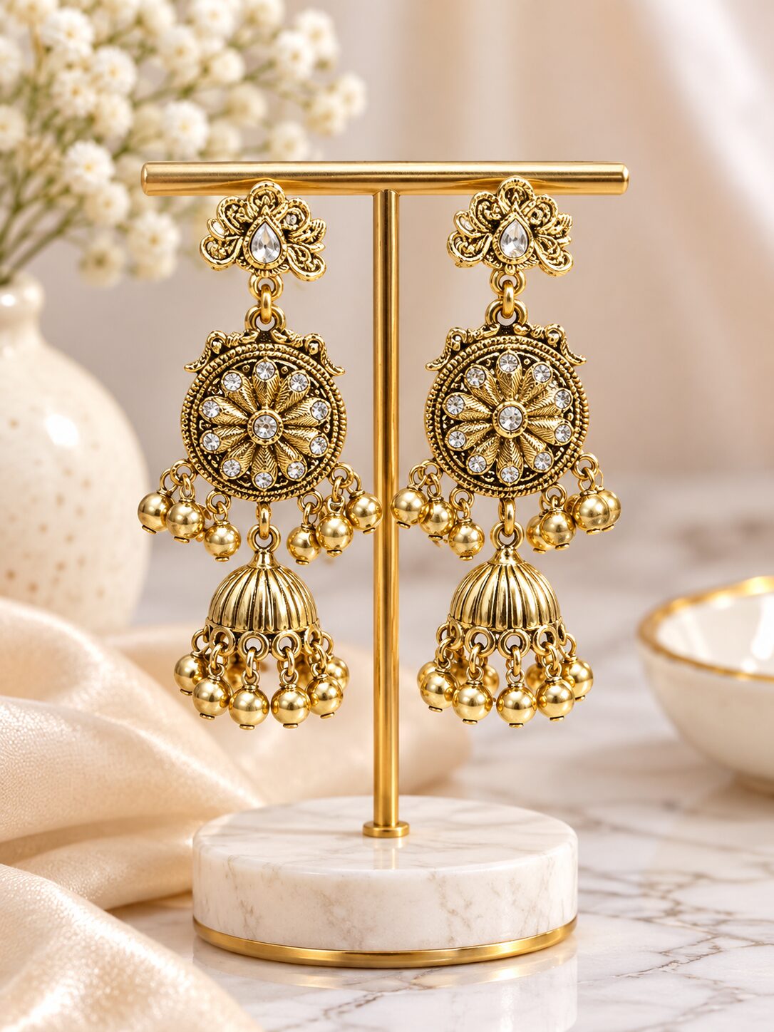 2026/09/1003581753.jpg Antique Gold Floral Designer Jhumka Earrings with Stone & Bead Detailing - Image 1