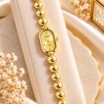 Elegant Gold Beaded RENOS Quartz Bracelet Watch for Women