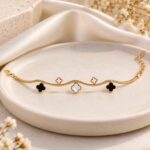 Elegant Gold-Tone Clover Charm Bracelet | Black & White Enamel