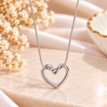 Silver Open Heart Pendant Necklace with Elegant Infinity Knot Design for Women